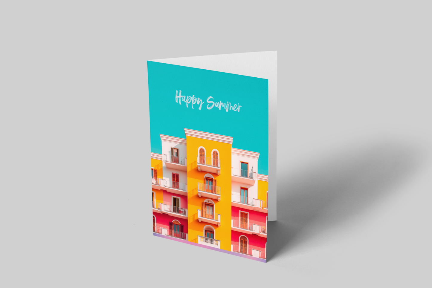 Greeting card with colorful building design and 'Happy Summer' text on a gray background