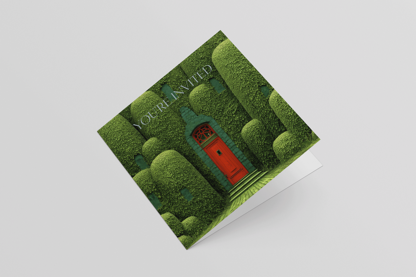 Greeting card with a green door and trees design on a white background