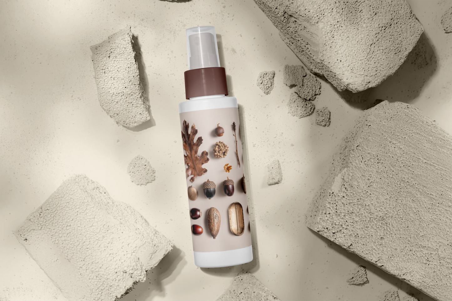 Skincare bottle with natural ingredients on a textured stone background