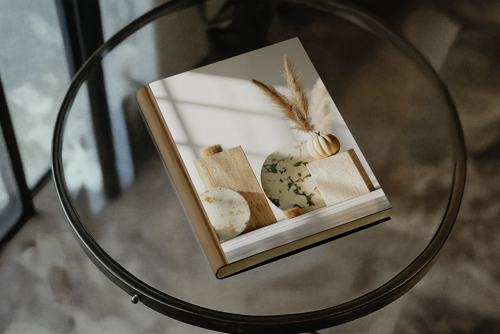 Book with a cover featuring images of food items on a glass table