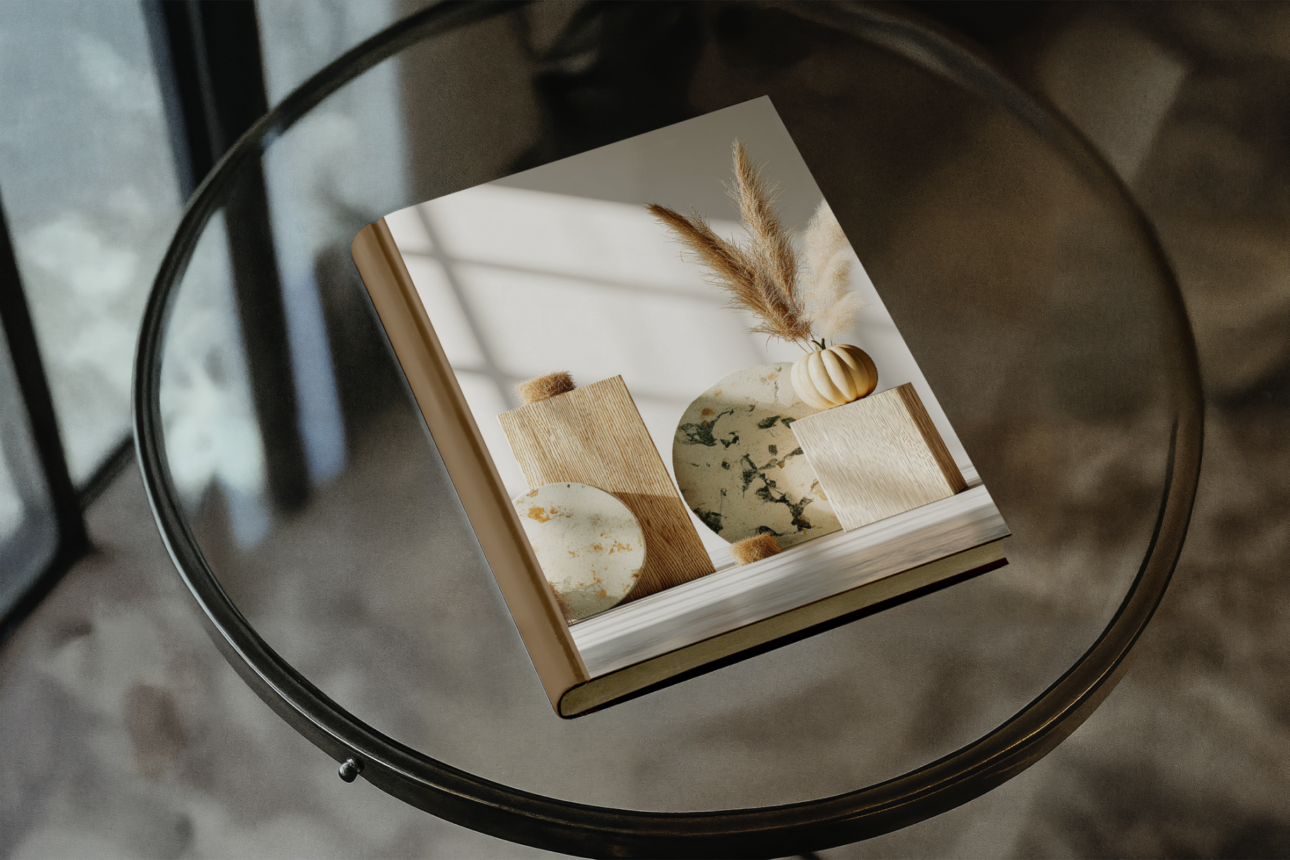 Book with a cover featuring images of food items on a glass table