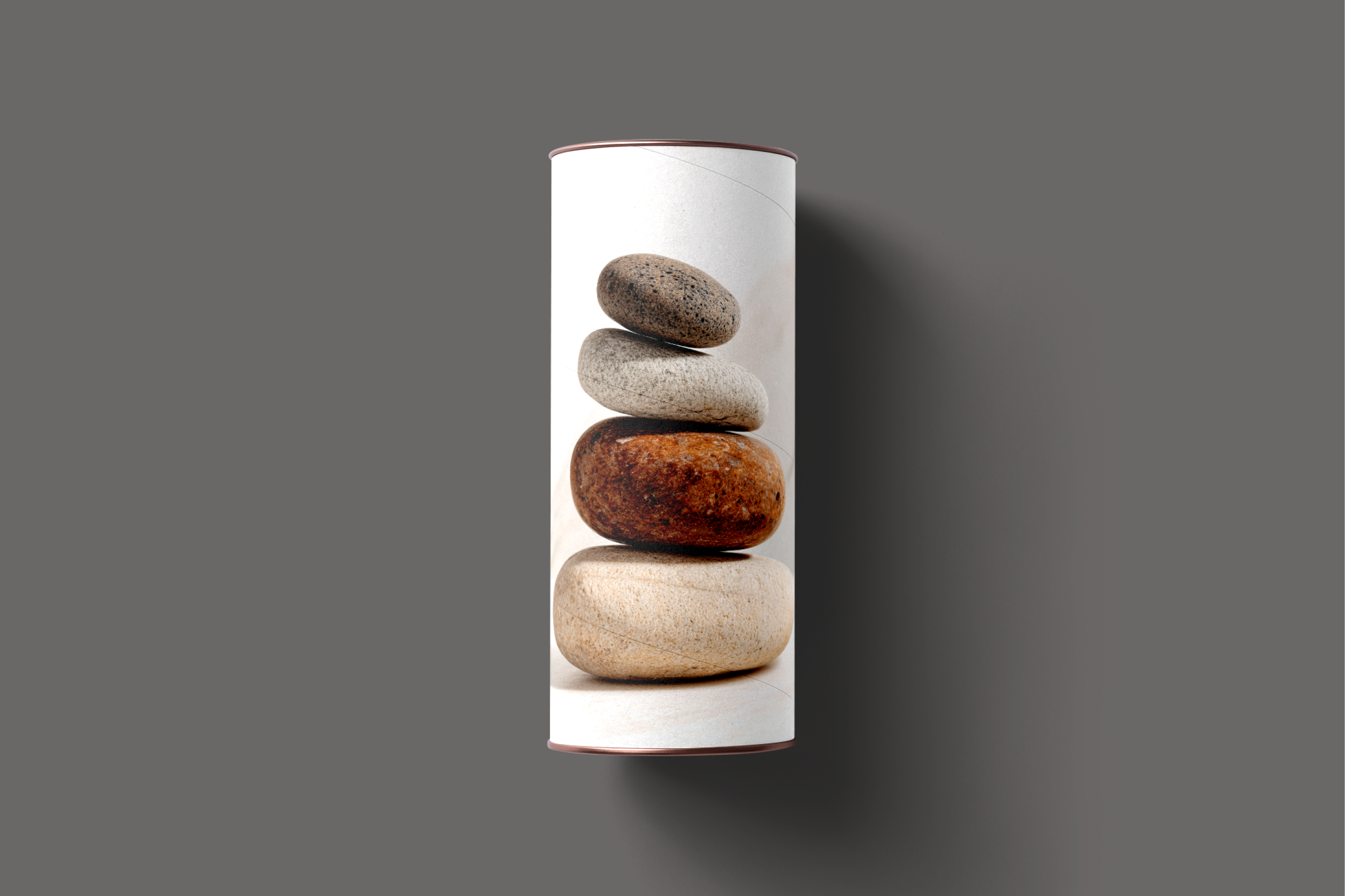  cylindrical product packaging with stacked stones design on a gray background