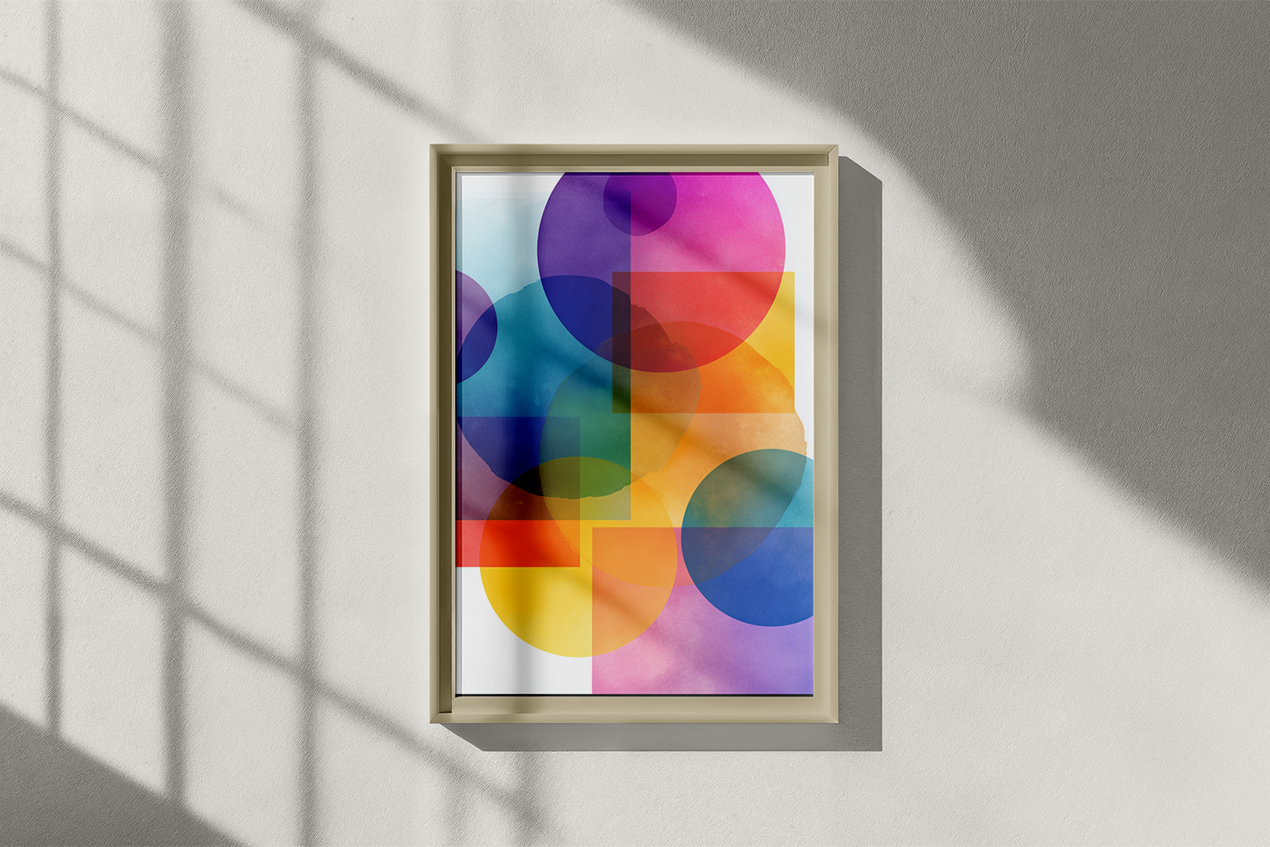 Colorful abstract art print in a wooden frame on a light gray wall.