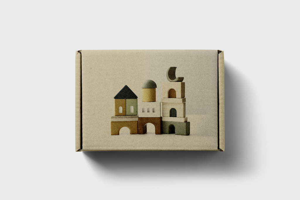 Cardboard box with a miniature architectural model on a light gray background