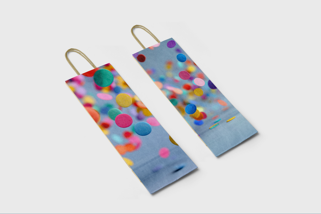 Two colorful polka dot bags on a white background