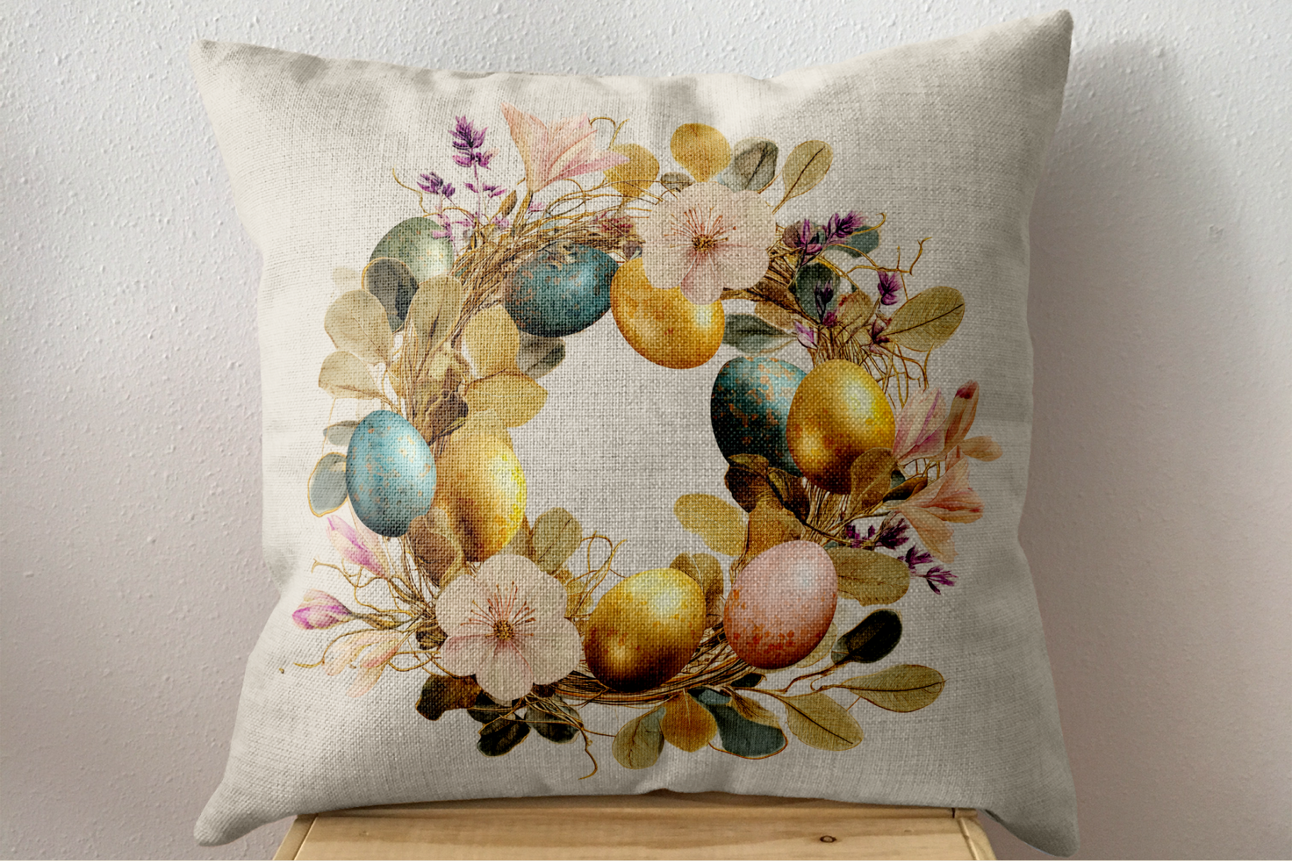 Decorative pillow with floral and egg design on a neutral background