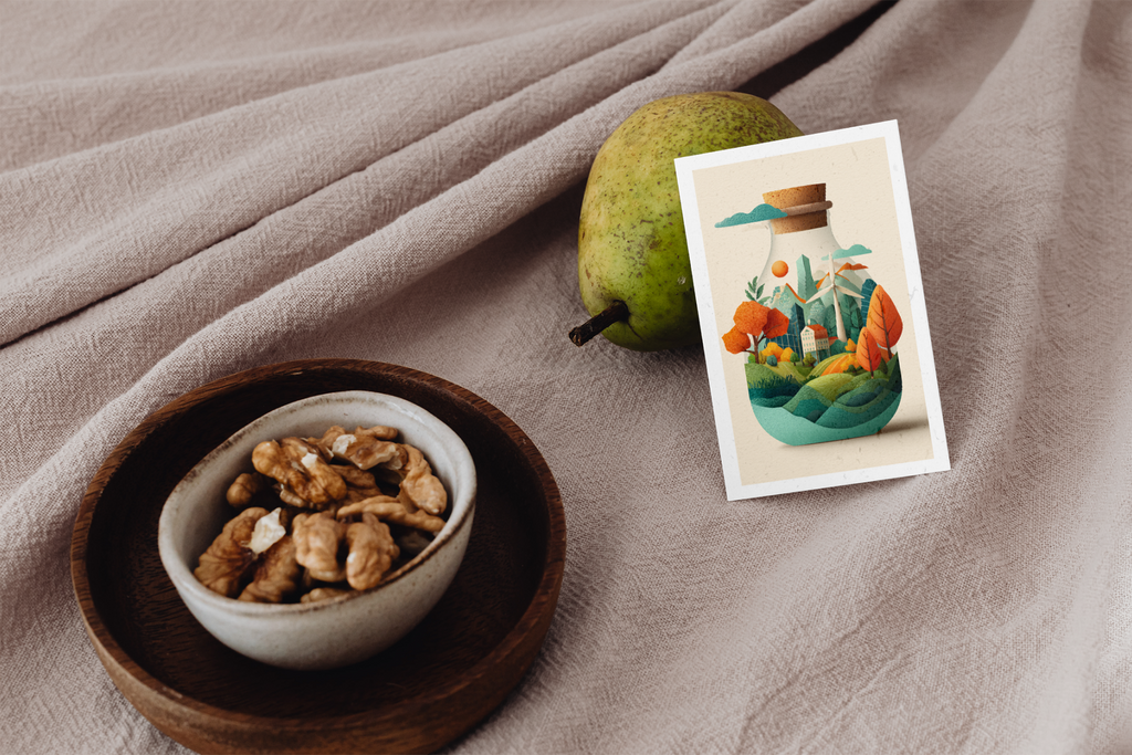 Bowl of nuts, pear, and vintage-style illustration on a textured fabric background
