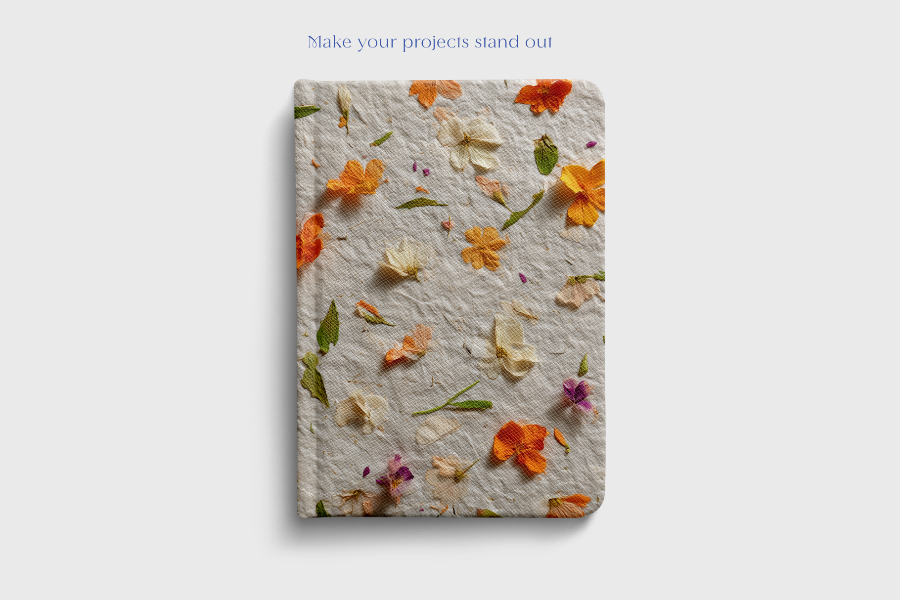 Notebook with floral design on a light gray background
