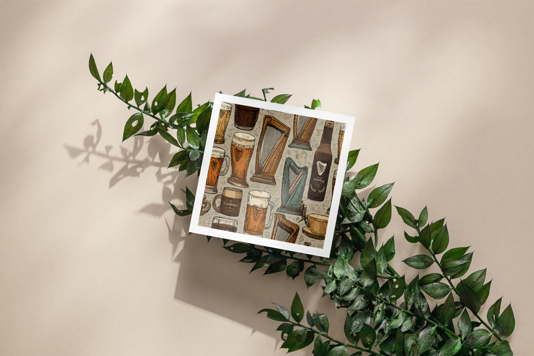 Framed artwork with beer-themed design on a beige background with green leaves.