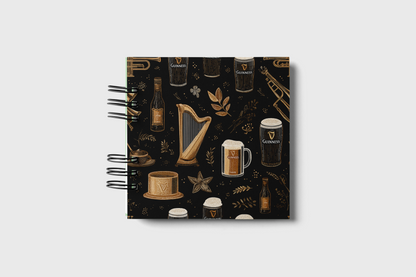 Notebook with Guiness-themed design on a white background