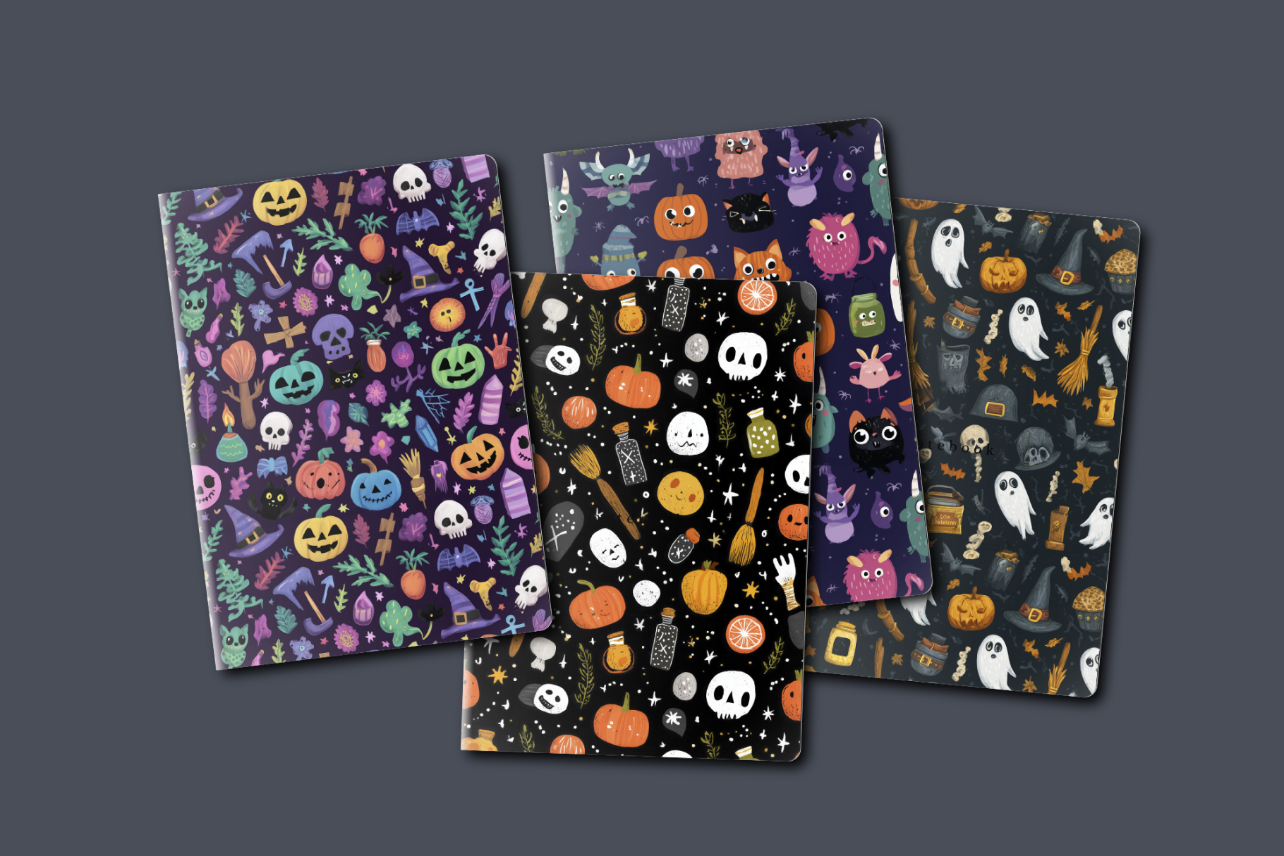 Four Halloween-themed notebooks with colorful designs on a dark gray background