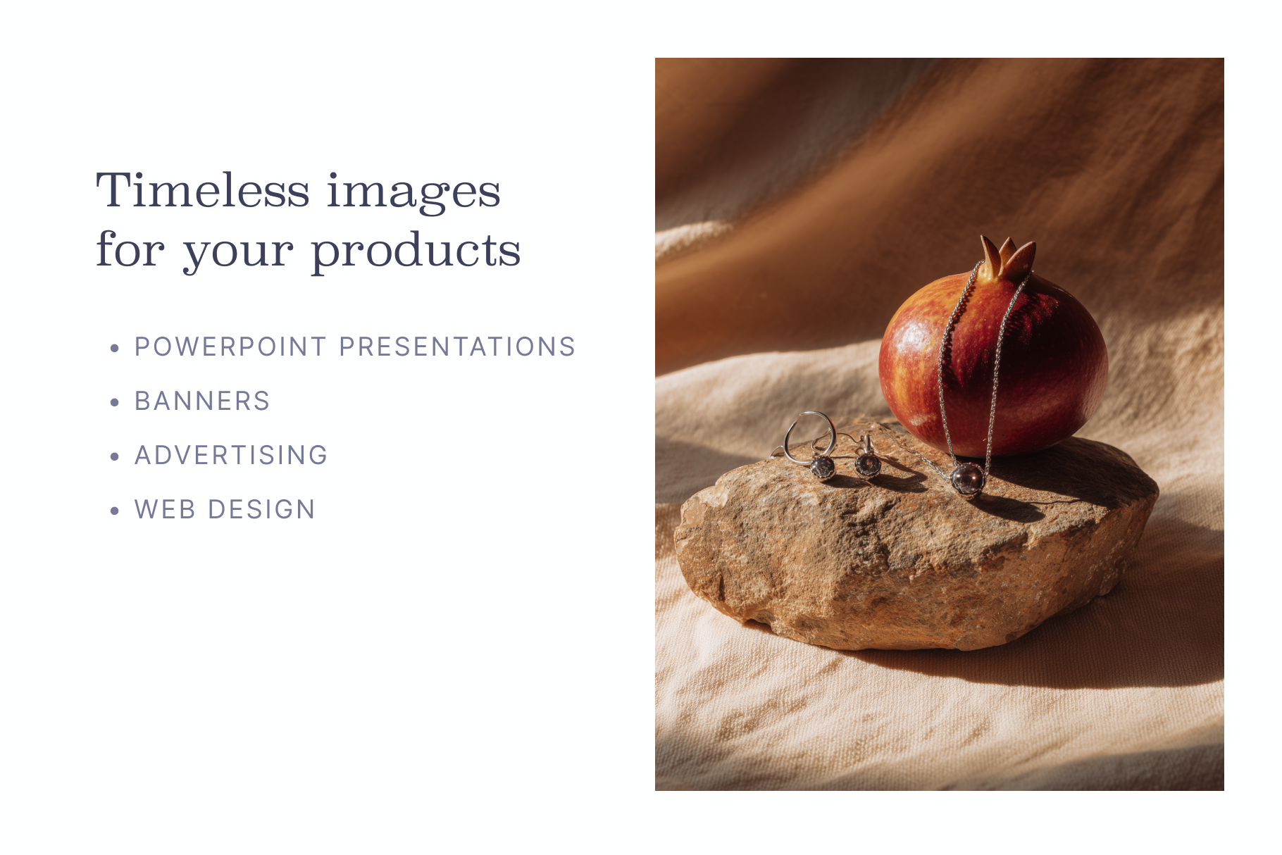 Pomegranate with jewelry on a rock against a textured background
