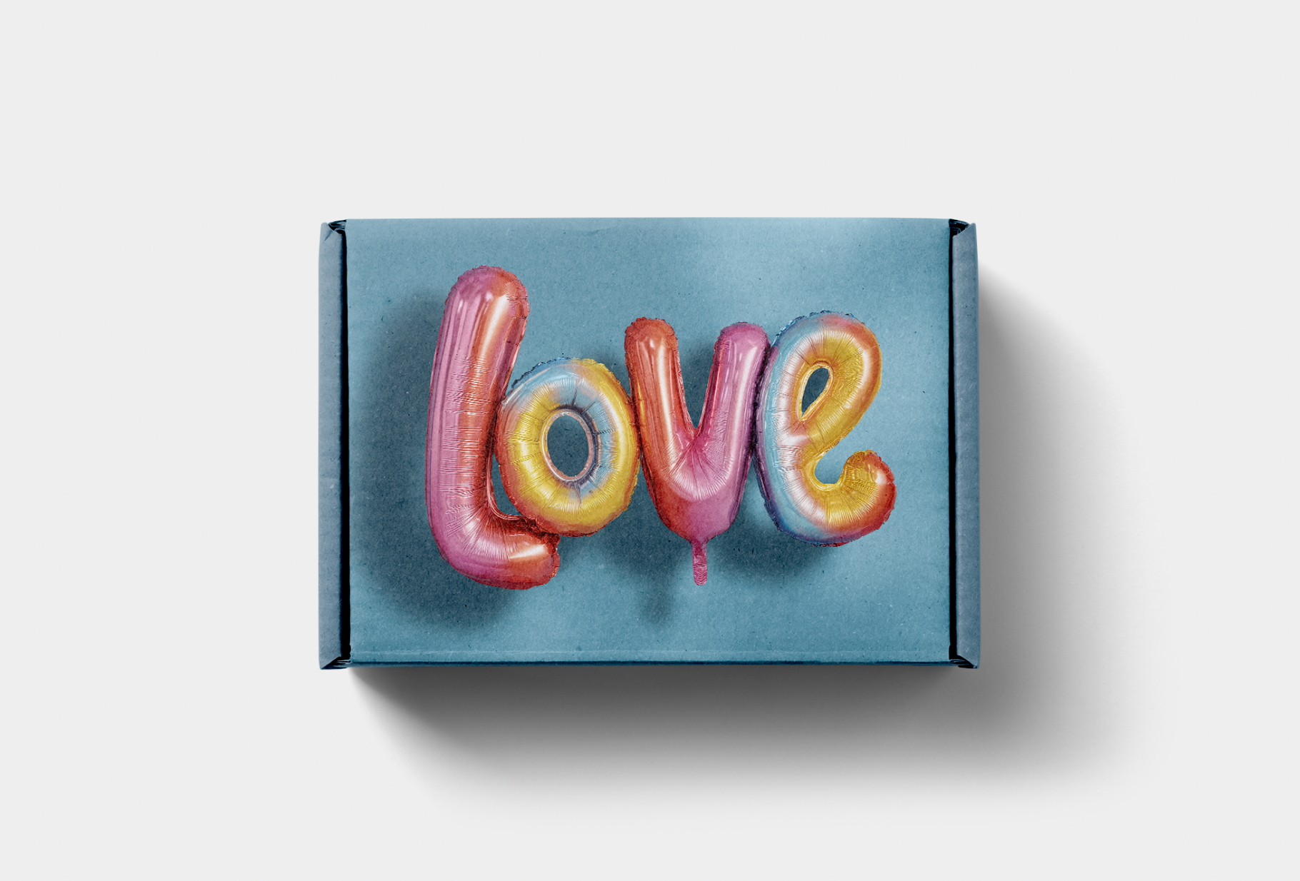 Blue box with 'LOVE' spelled out in colorful balloon letters on a light gray background