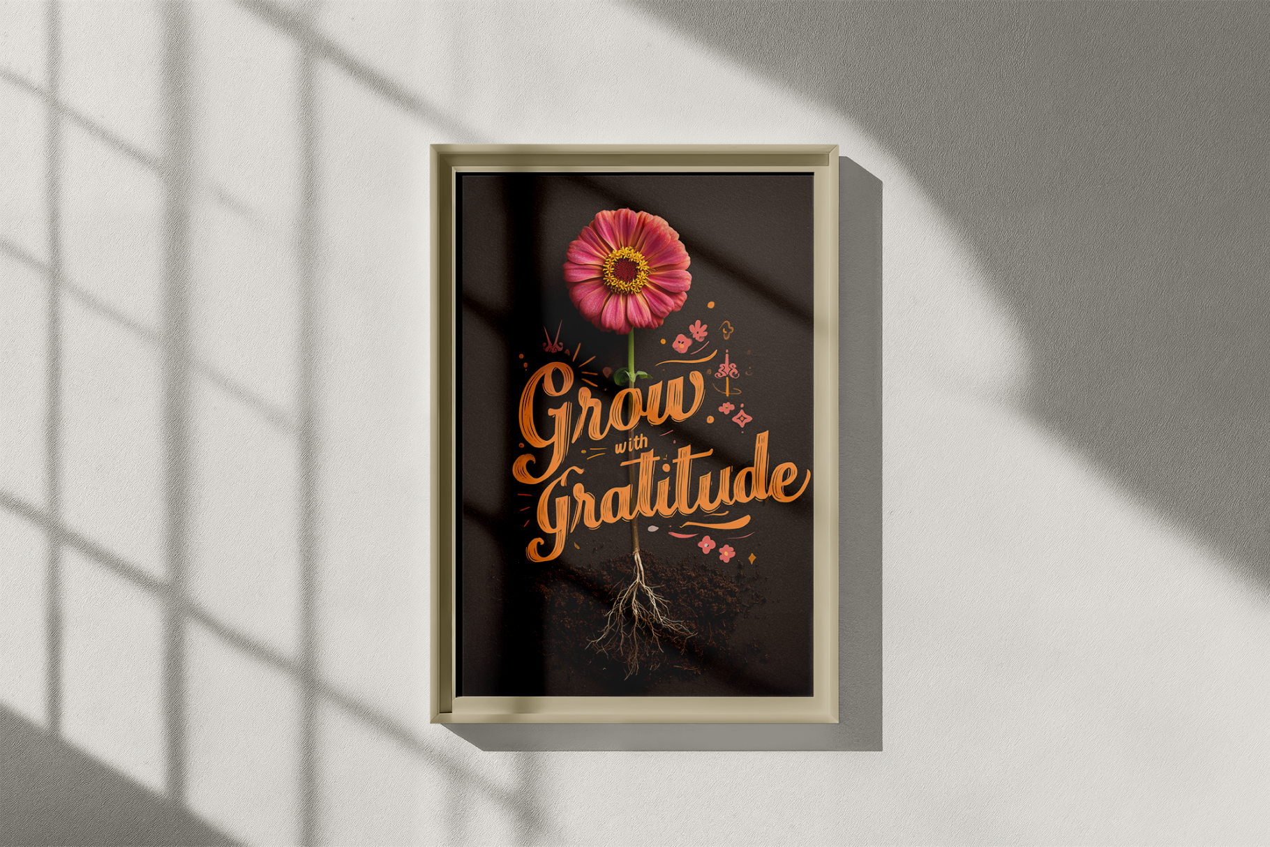 Framed artwork with a pink flower and 'Grow with Gratitude' text on a dark background.