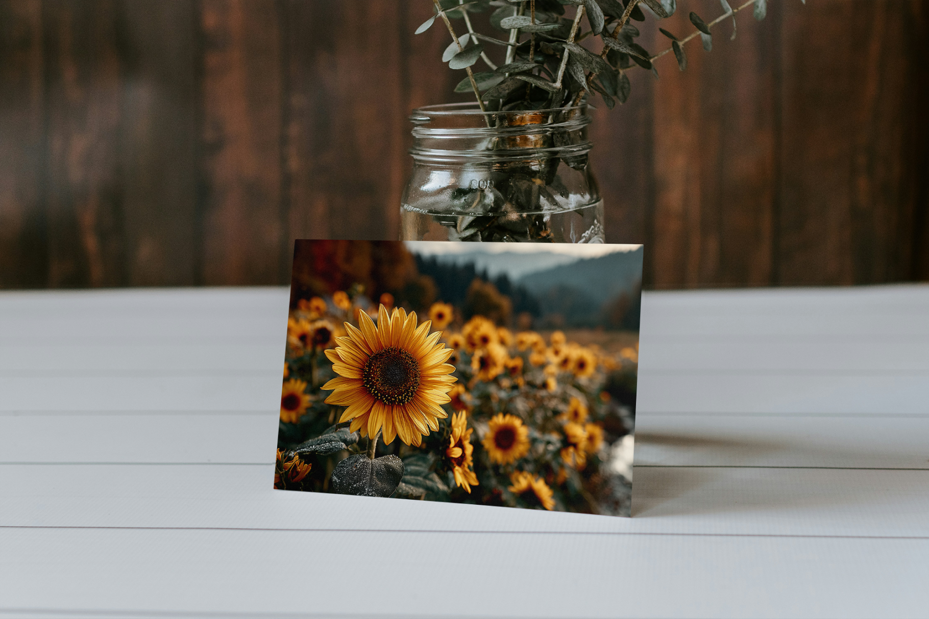 Card with sunflower design on a wooden surface