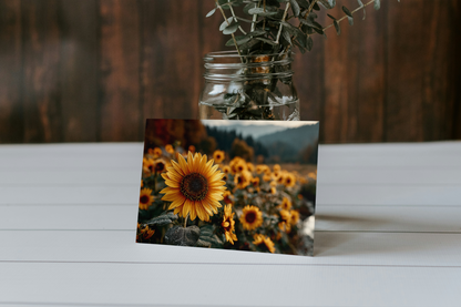 Card with sunflower design on a wooden surface