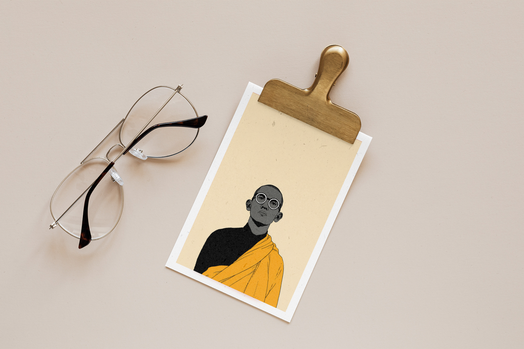 Clipboard with a portrait of a person in black and orange attire, accompanied by eyeglasses on a beige background.