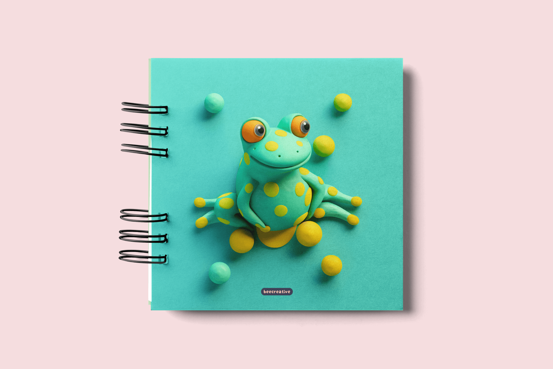 Green notebook cover with a frog made of plasticine