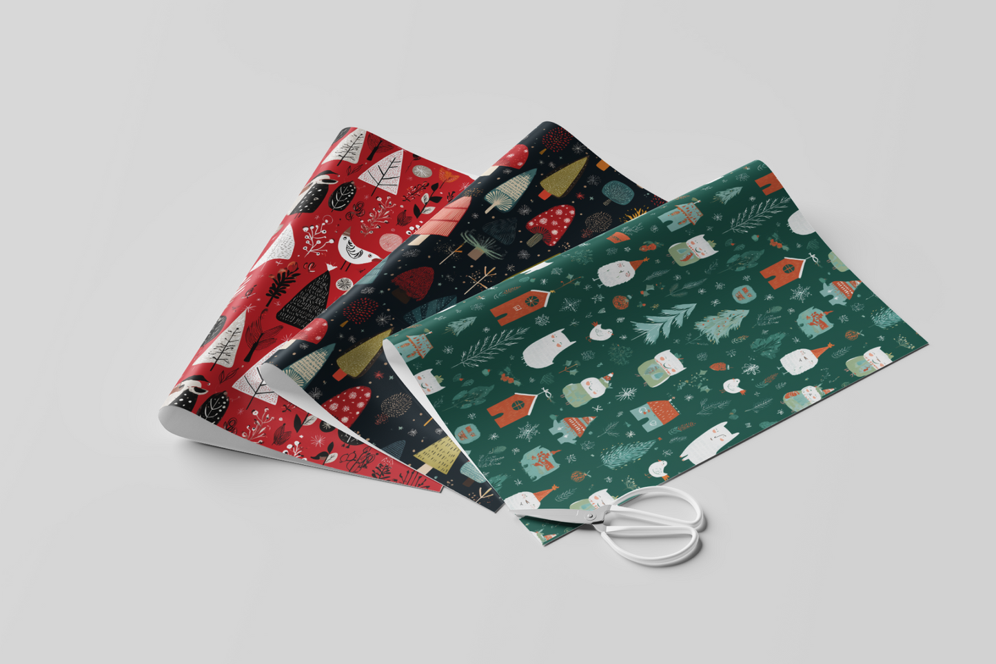 Three fabric swatches with Christmas patterns and a pair of scissors on a light gray background