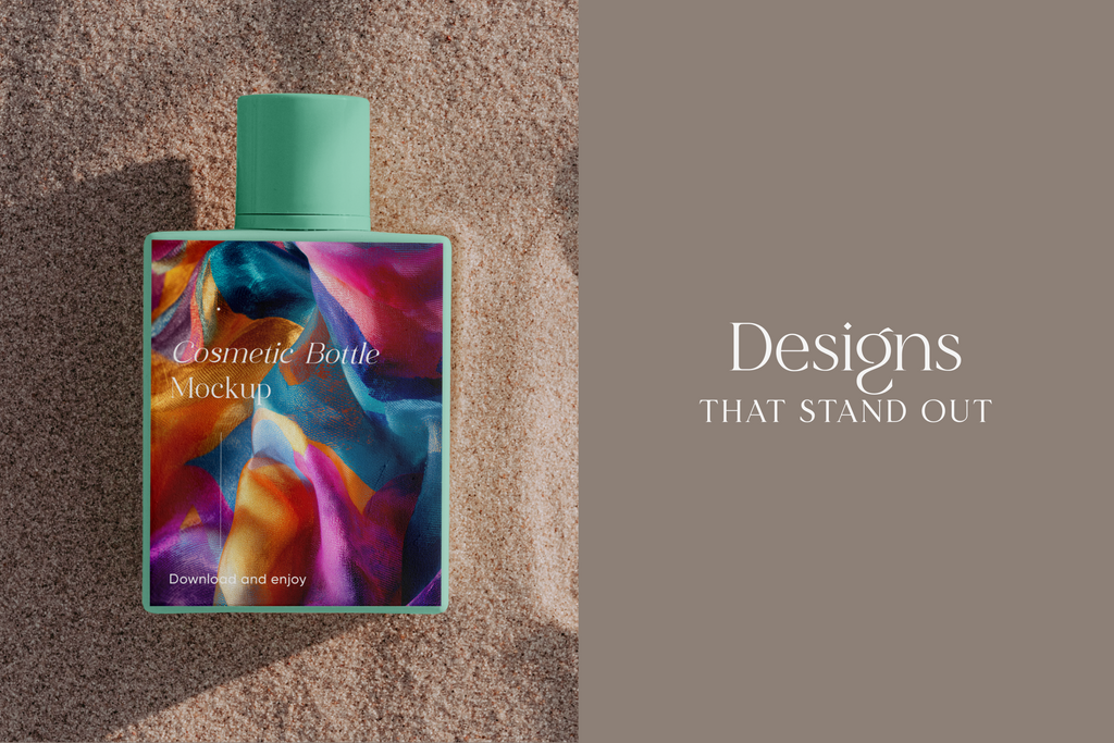 A cosmetic bottle mockup with a mint green cap and a colorful abstract label, placed on textured sand next to a taupe panel with the text 'Designs THAT STAND OUT'.