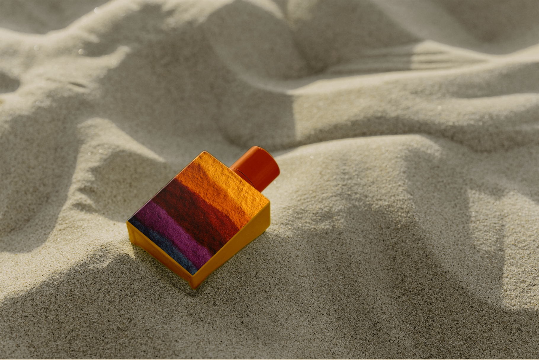 Colorful sand toy on a sandy surface