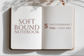 An open notebook mockup on a white surface with soft shadows and dried flowers at the top. The left page reads 'SOFT BOUND NOTEBOOK' and the right page reads '5 PHOTOGRAPHS / PNG / HIGH RES'.