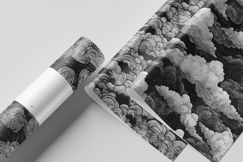 Two rolls of black and white patterned paper on a light gray background