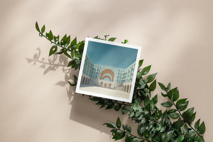 Polaroid-style photo of a building with a rainbow on a branch against a beige background
