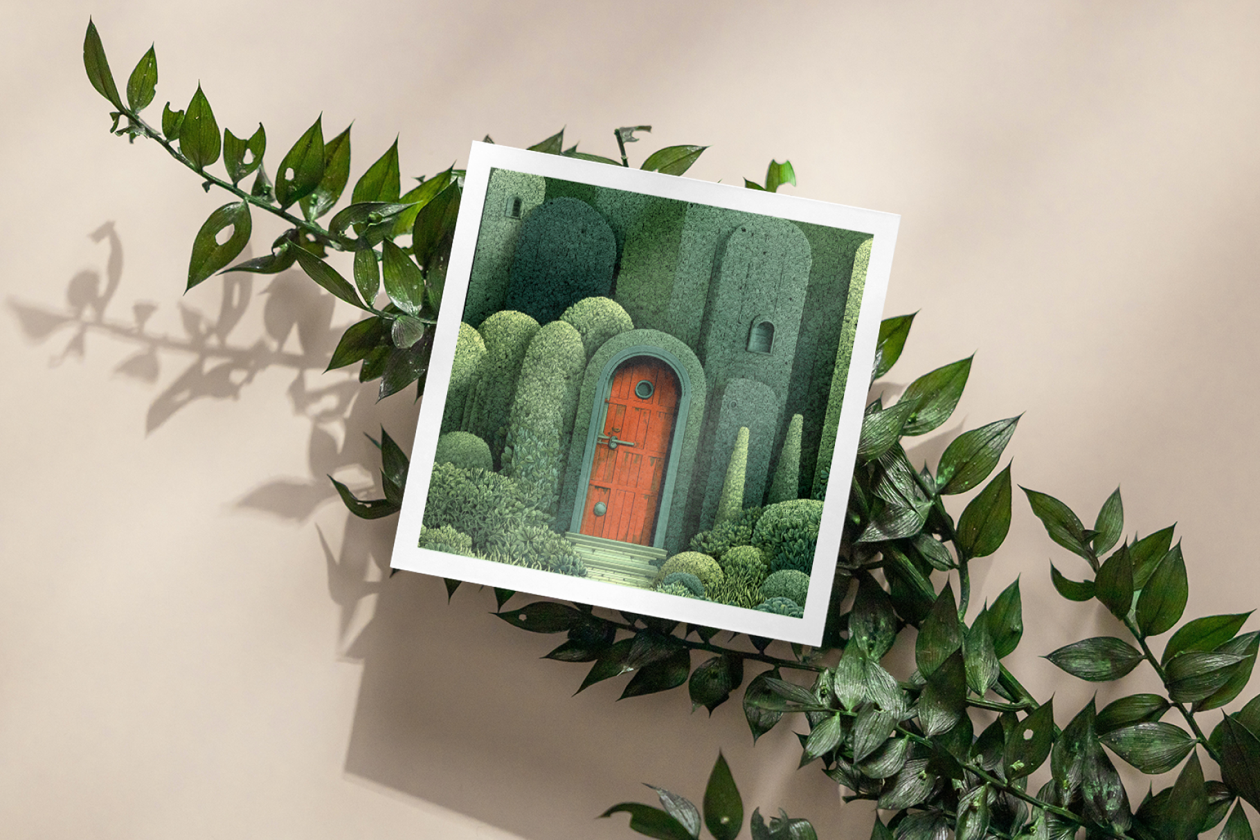 Framed artwork of a fantasy door surrounded by greenery on a beige wall.