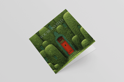 Greeting card with a green door and trees design on a white background